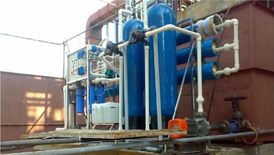 Compact packaged treatment plant with FRP vessels and pipework installed at a residential development