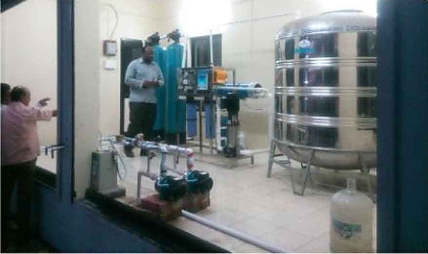 Treated water storage tank and softening plant installed in a hotel utility room