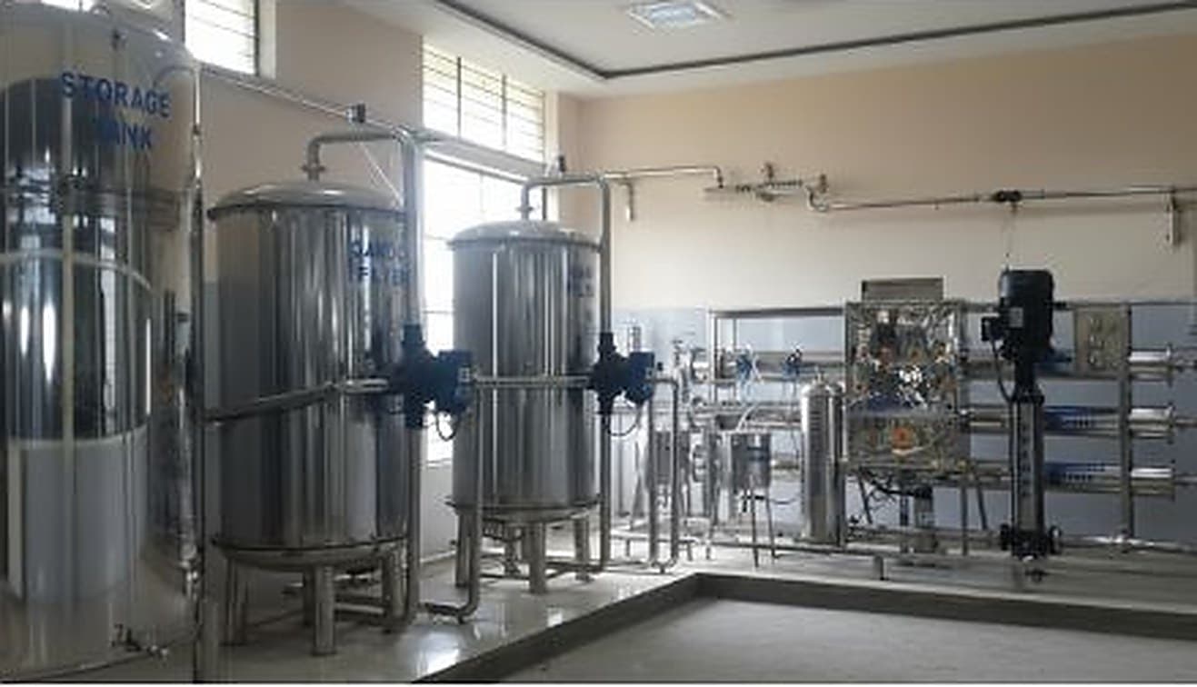 Iron removal filter vessels and aeration pipework treating borewell water at a plant installation